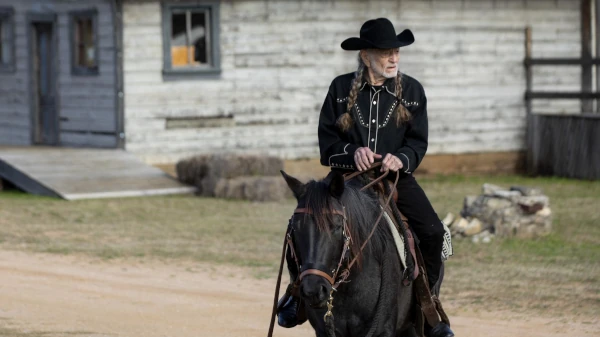 Willie Nelson riding his horse